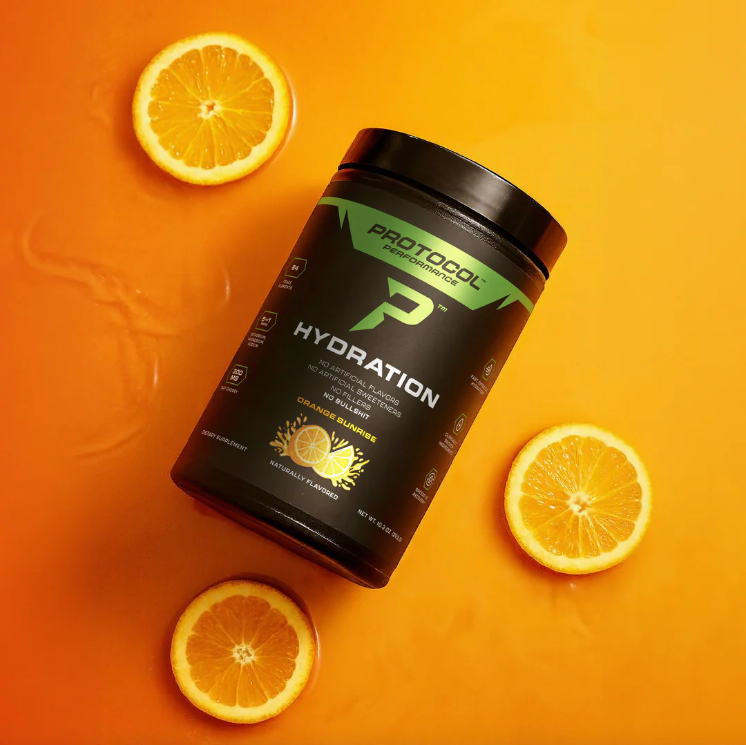 Protocol Hydration by Protocol Performance product photo: hydration stick packs and a glass of water styled in a clean, minimal wellness setting