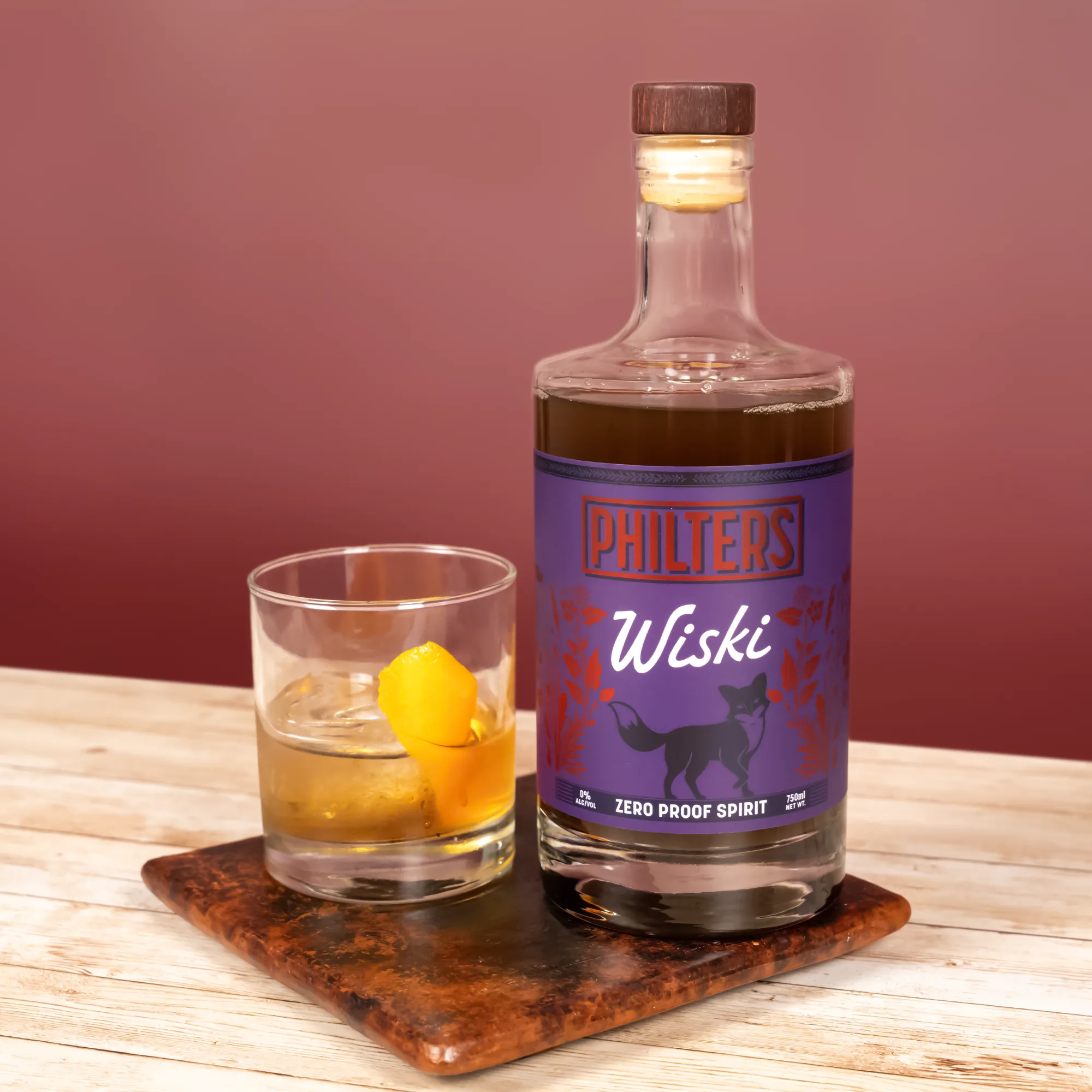 Philters Wiski zero-proof spirit alternative showcased as a premium nightcap ritual in an elegant bottle on a bar cart.
