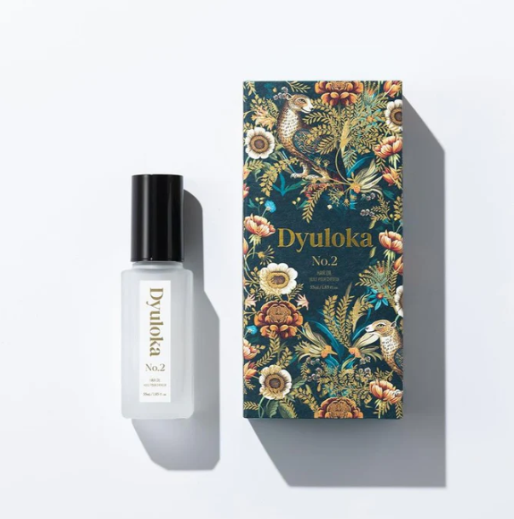 Applying Dyuloka Hair Oil